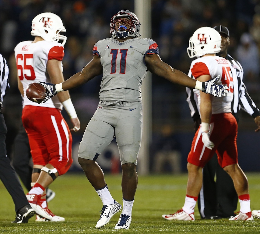 Junior Joseph #11 celebrates a fumble recovery