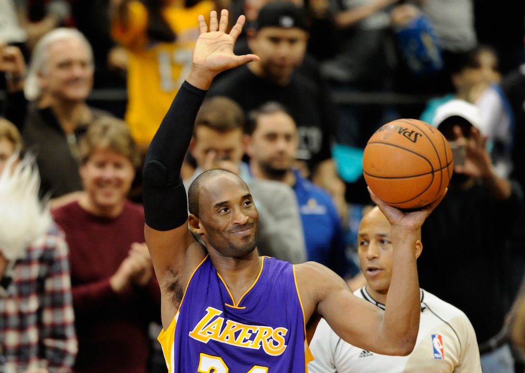 Kobe Bryant waves to the crowd