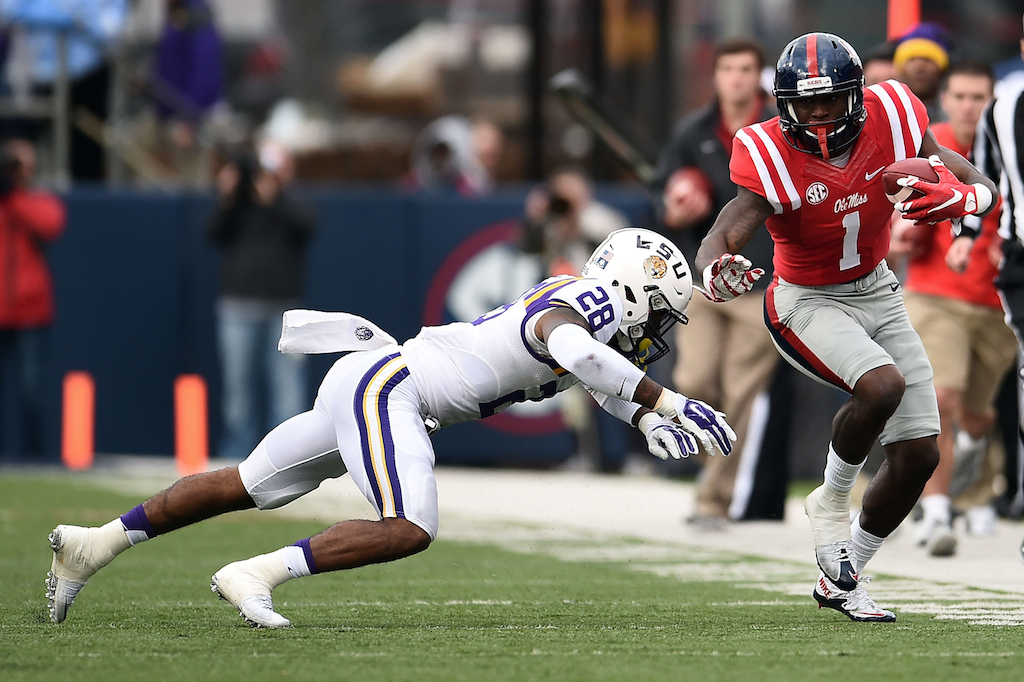 Laquon Treadwell #1 of the Mississippi Rebels is pursued by Jalen Mills #28 of the LSU Tigers