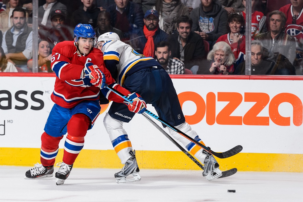 MONTREAL, QC - OCTOBER 20: Max Pacioretty #67 of the Montreal Canadiens sidesteps Robert Bortuzzo #41 of the St. Louis Blues during the NHL game at the Bell Centre on October 20, 2015 in Montreal, Quebec, Canada.
