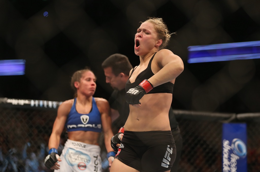 ANAHEIM, CA - FEBRUARY 23: Ronda Rousey celebrates her UFC Bantamweight Title over Liz Carmouche at Honda Center on February 23, 2013 in Anaheim, California.