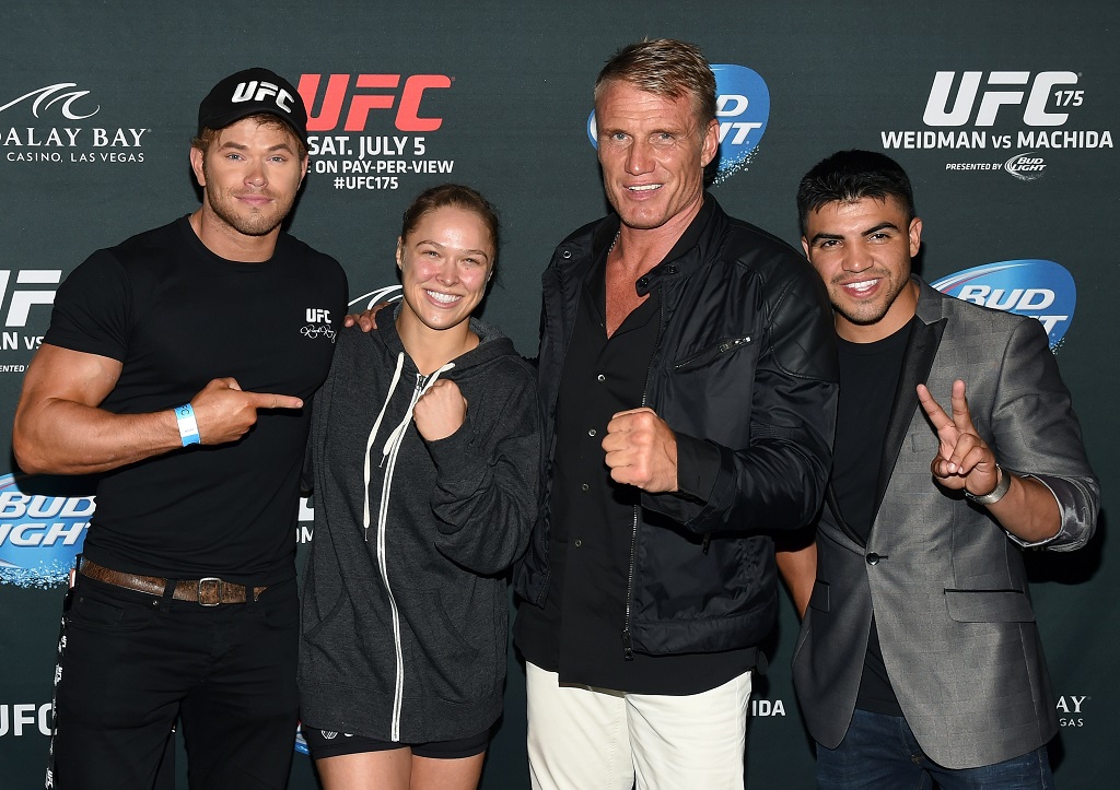 LAS VEGAS, NV - JULY 05: (L-R) Cast members from the upcoming movie "The Expendables 3," actor Kellan Lutz, UFC bantamweight champion and actress Ronda Rousey, actor Dolph Lundgren and boxer Victor Ortiz, attend the UFC 175 event at the Mandalay Bay Events Center on July 5, 2014 in Las Vegas, Nevada. Rousey defeated Alexis Davis by knockout 16 seconds into the evening's co-main event.
