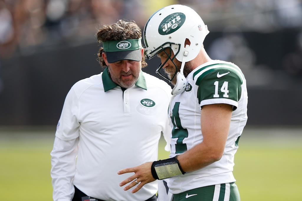 Ryan Fitzpatrick gets his thumb looked at by a trainer