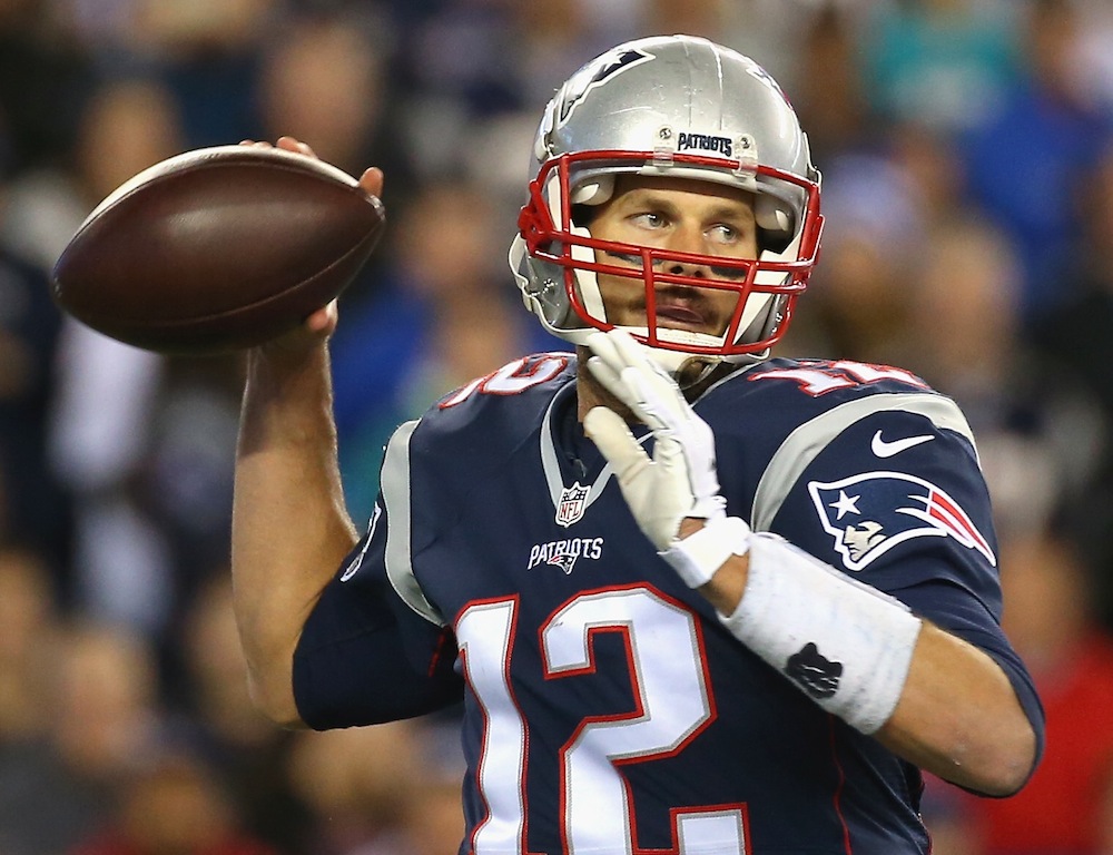 Tom Brady sets to throw against the Dolphins