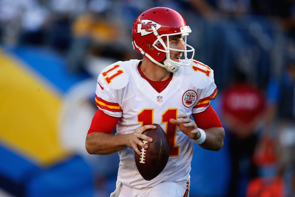 Quarterback Alex Smith begins a play.