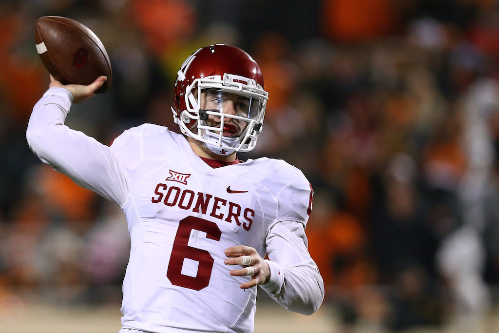 Baker Mayfield throws against Oklahoma State