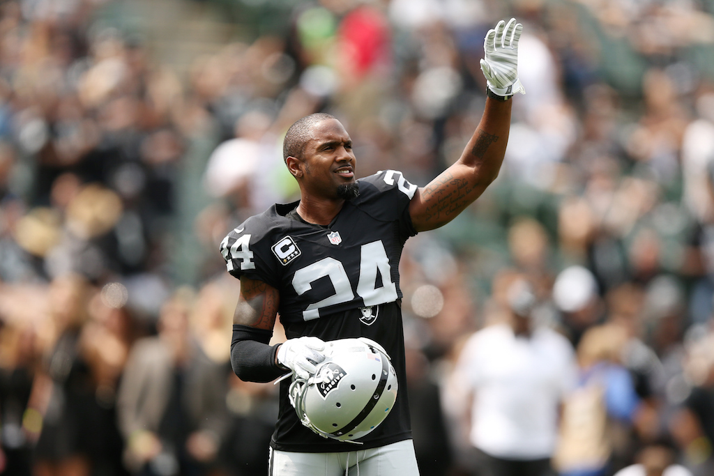 charles woodson waves to fans