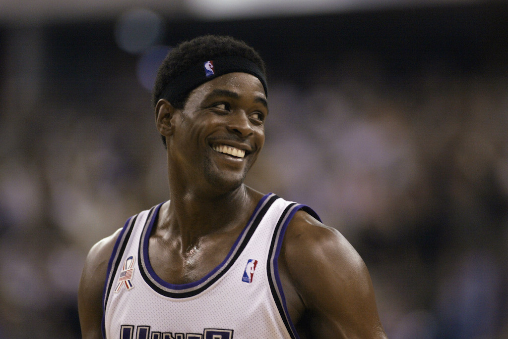 Chris Webber laughs and smiles as he walks off the court.