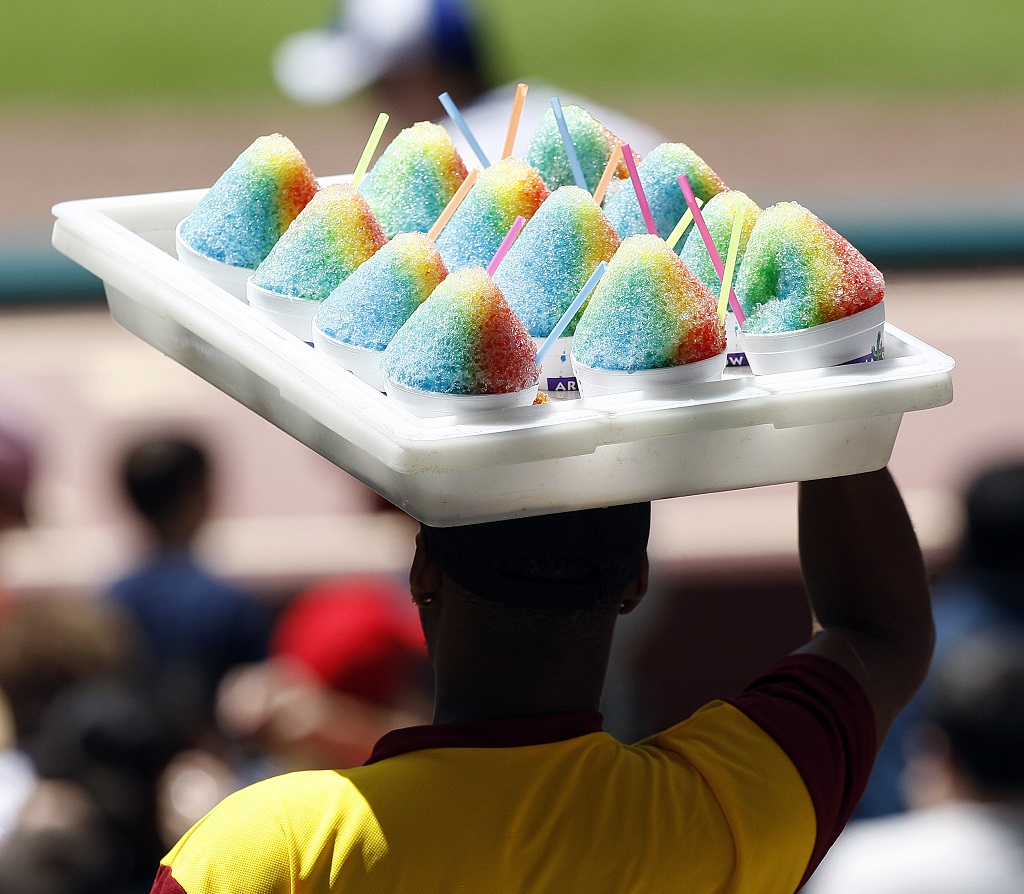 HOUSTON - MAY 14:  A concessions worker sells snow cones on a hot day at Minute Maid Park on May 14, 2011 in Houston, Texas.