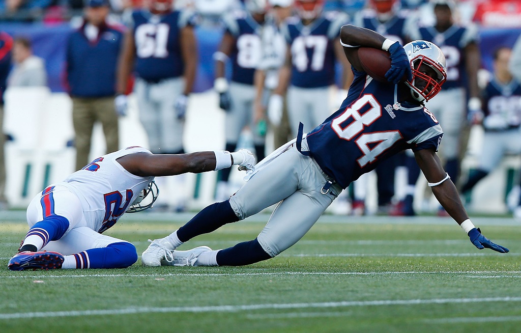 Deion Branch is tackled by a New York Giant.