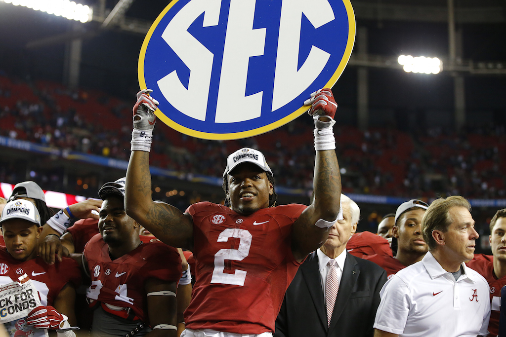 Derrick Henry celebrates after Alabama wins the SEC
