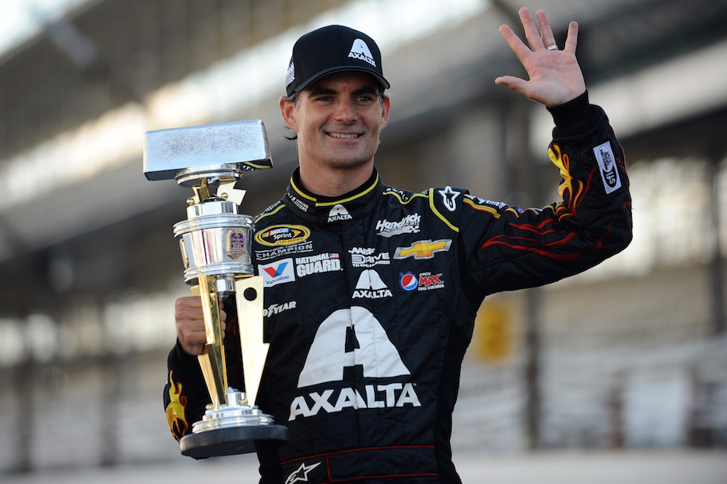 Jeff Gordon, driver of the Axalta Chevrolet, celebrates with the trophy after winning the NASCAR Sprint Cup Series.