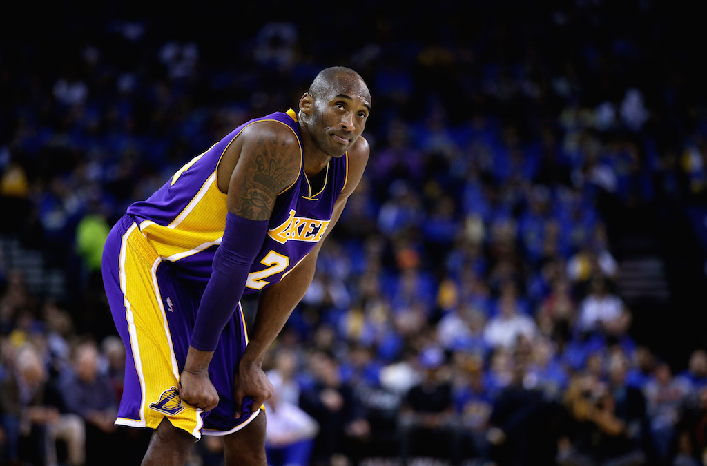 Kobe Bryant puts his hands on his knees before a free throw.