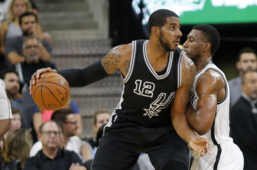 LaMarcus Aldrige works in the post.