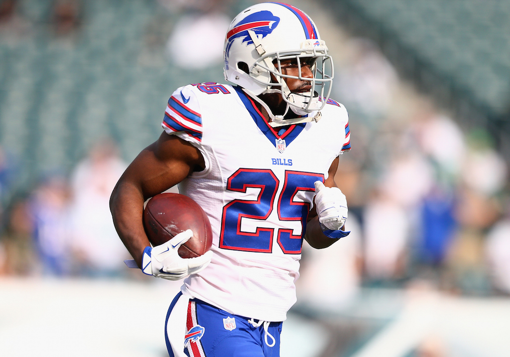 Running back LeSean McCoy jogs across the field with the football.