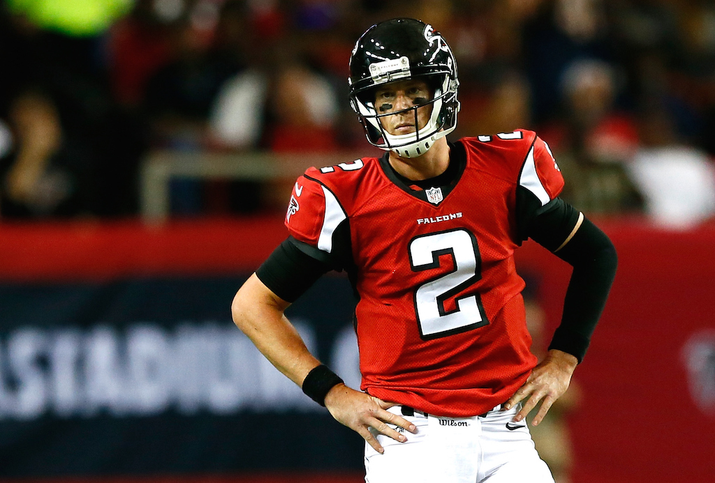 Matt Ryan with his hands on his hips, looking off into the distance