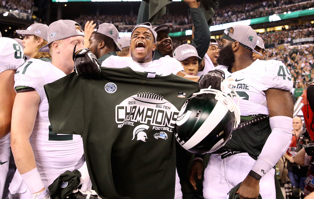 Michigan State players celebrate winning the Big Ten