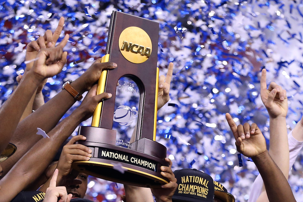 INDIANAPOLIS, IN - APRIL 06: The Duke Blue Devils hold up the championship trophy after defeating the Wisconsin Badgers during the NCAA Men's Final Four National Championship at Lucas Oil Stadium on April 6, 2015 in Indianapolis, Indiana. Duke defeated Wisconsin 68-63.