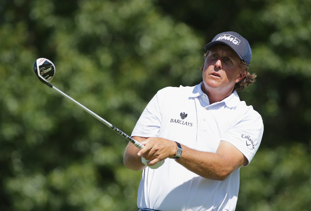Phil Mickelson hits a tee shot during The Barclays