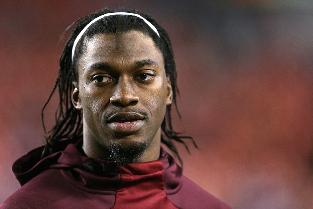 Robert Griffin III looks over before a game against the Cowboys