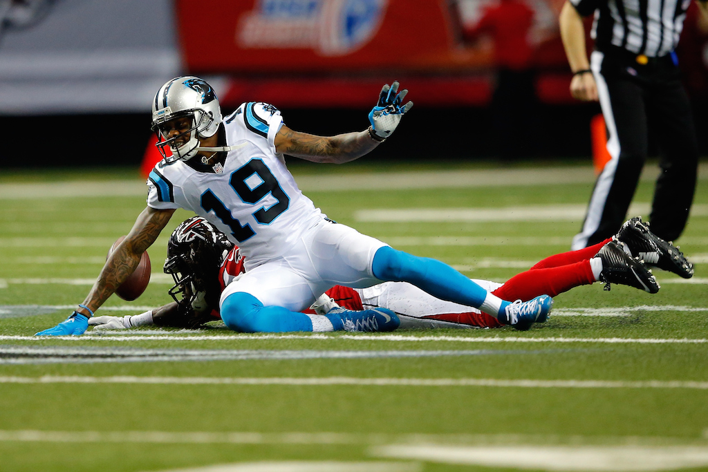 Ted Ginn Jr. tries to make a play against the Falcons