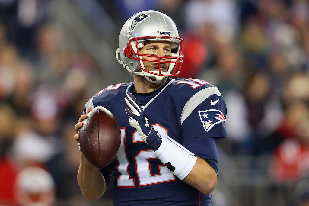Tom Brady looks to throw against the Eagles