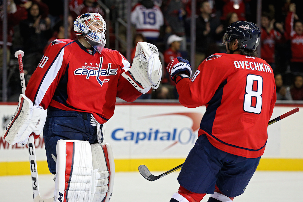 Goalie Braden Holtby #70 of the Washington Capitals and teammate Alex Ovechkin #8 celebrate after defeating the Edmonton Oilers