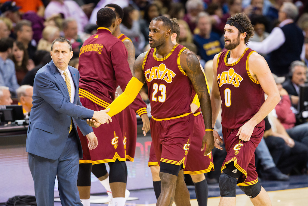 Head coach David Blatt celebrates with LeBron James #23 and Kevin Love #0 of the Cleveland Cavaliers during the first half against the Miami Heat 