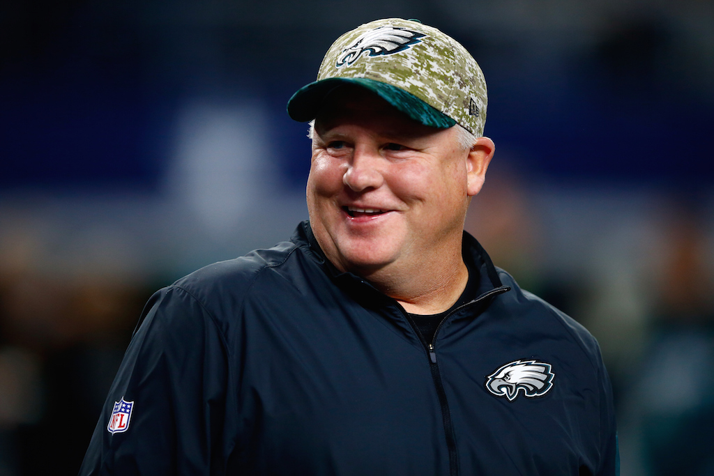 Chip Kelly looks on before a game against the Cowboys