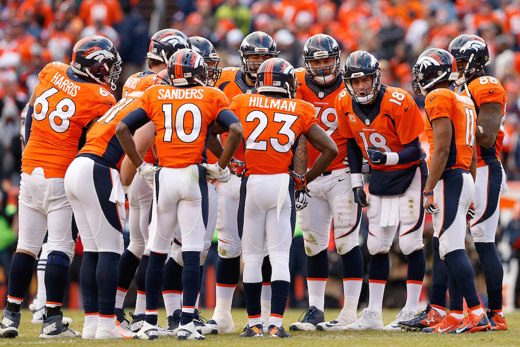 DENVER, CO - JANUARY 24: Quarterback Peyton Manning #18 of the Denver Broncos talks with his team in the huddle during the AFC Championship game New England Patriots aat Sports Authority Field at Mile High on January 24, 2016 in Denver, Colorado. The Broncos defeated the Patriots 20-18. (Photo by Christian Petersen/Getty Images)