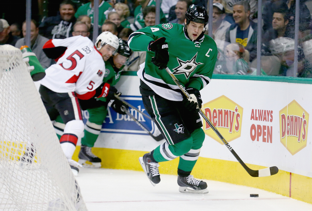 Jamie Benn #14 of the Dallas Stars controls the puck
