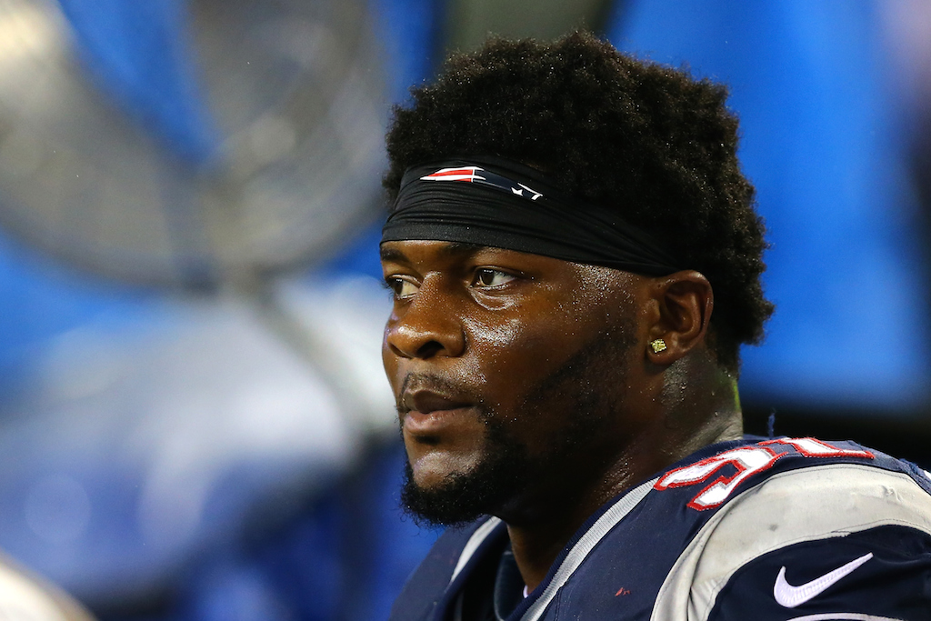Jamie Collins looks on during game