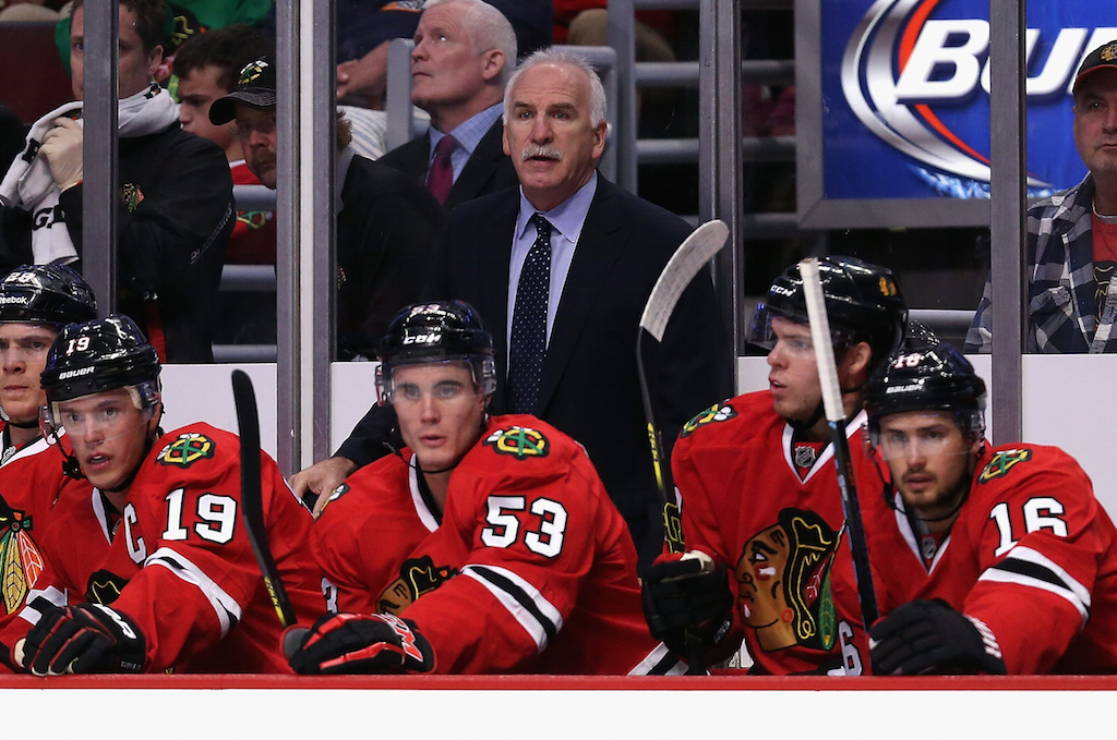The Chicago Blackhawks watch the action from the bench.