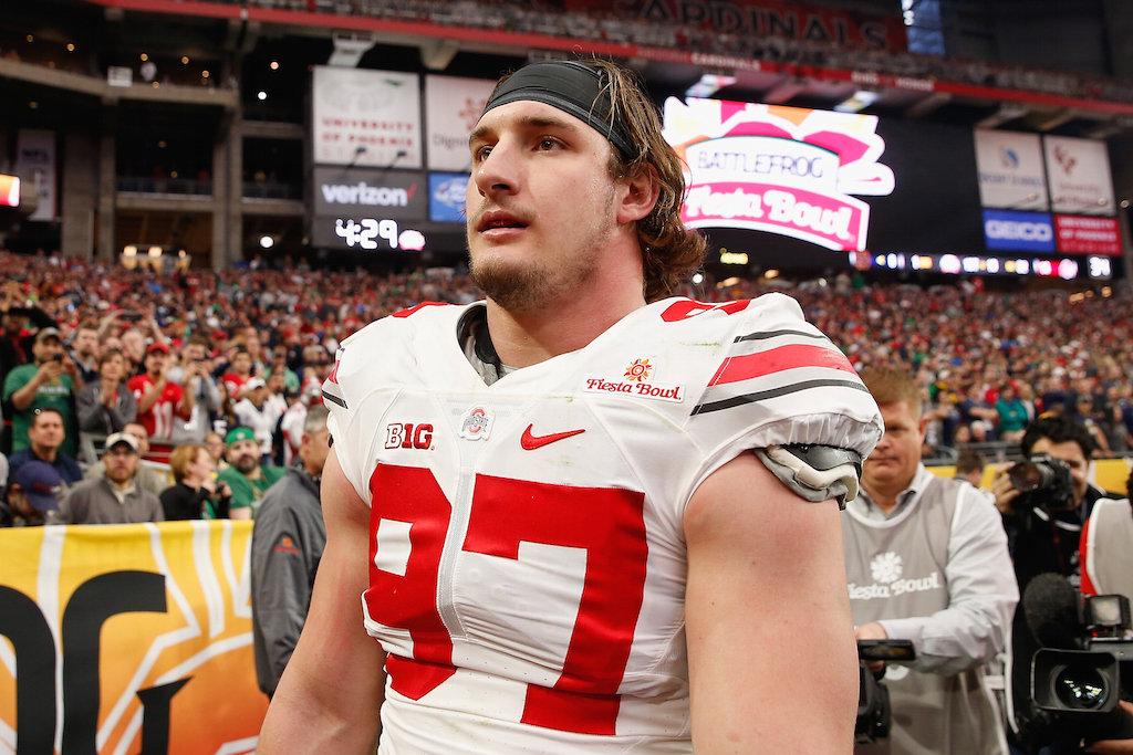 Defensive lineman Joey Bosa #97 of the Ohio State Buckeyes walks off the field after being ejected