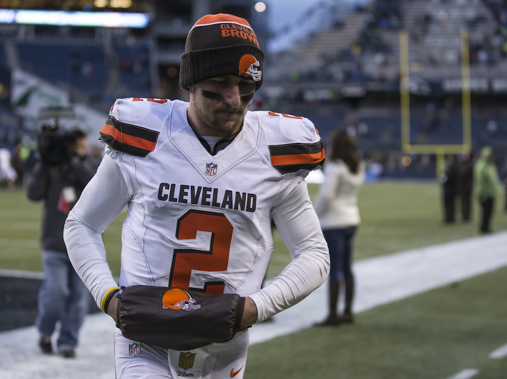 Johnny Manziel leaves the field after a game against the Seahawks