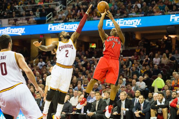 Kyrie Irving attempts to block Kyle Lowry's shot.