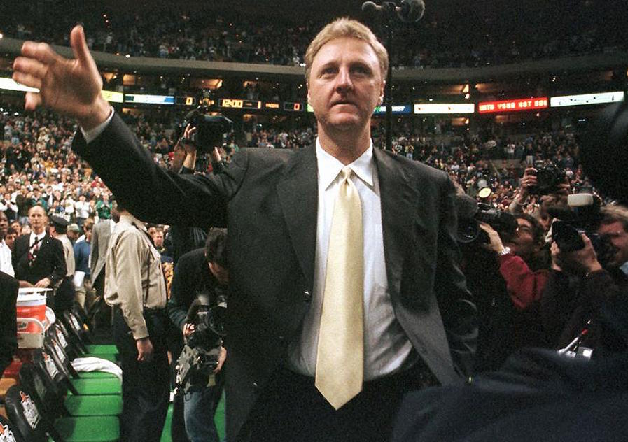 Larry Bird waves to the crowd.