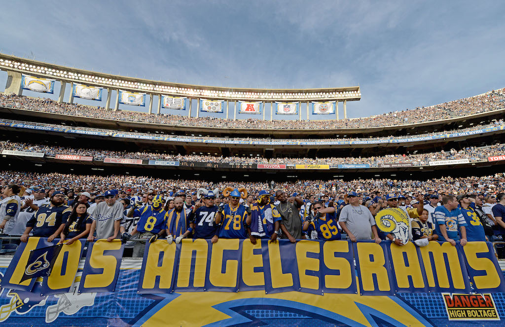 Fans hold up "Los Angeles Rams" sign