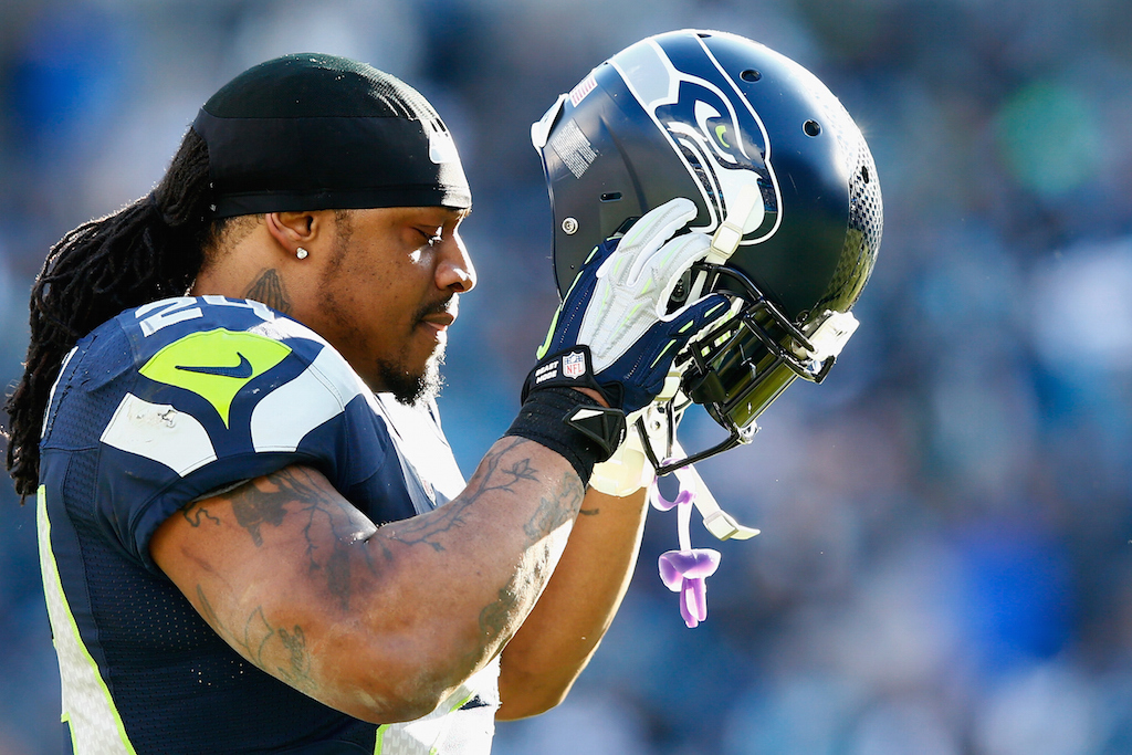 Marshawn Lynch puts his helmet on during the Divisional round game against the Panthers