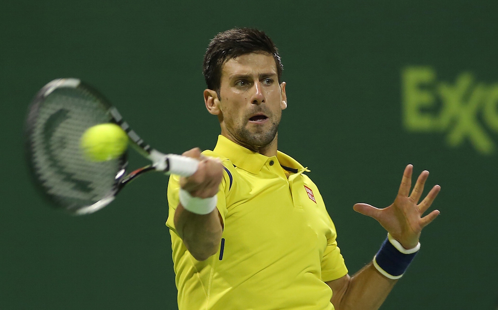 Novak Djokovic returns a shot with his forehand