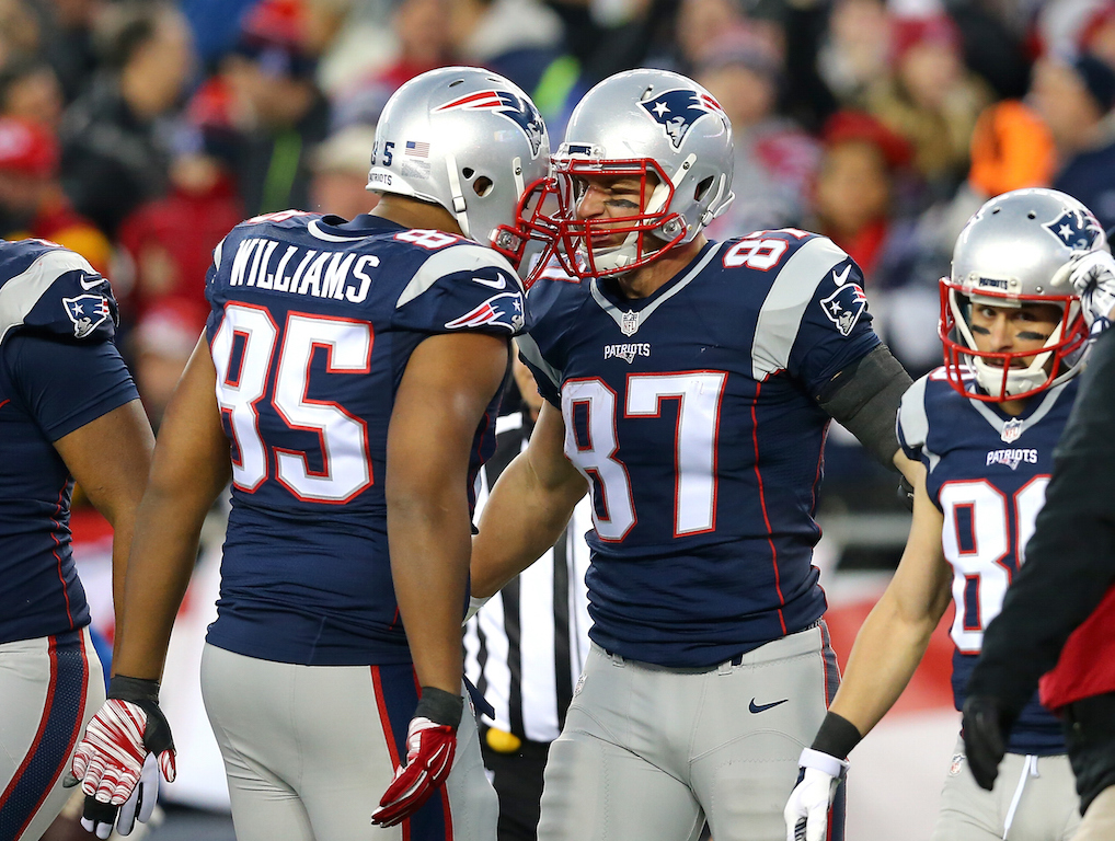 Rob Gronkowski #87 of the New England Patriots celebrates his first quarter touchdown with Michael Williams #85