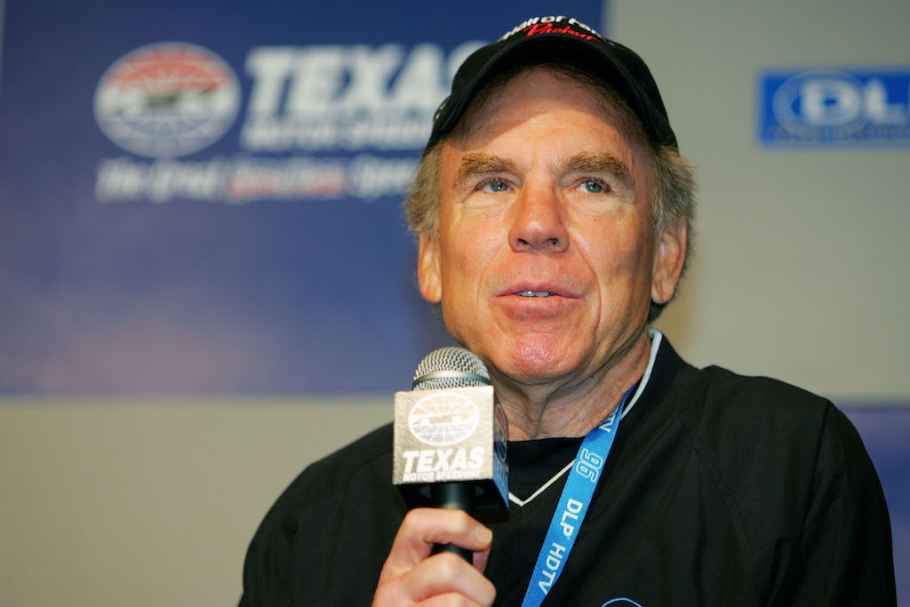 Roger Staubach speaks to the press during a media conference.