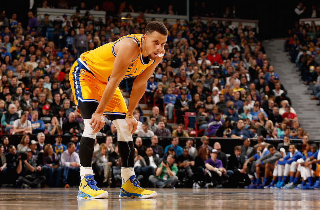 Stephen Curry rests during a game against the Kings