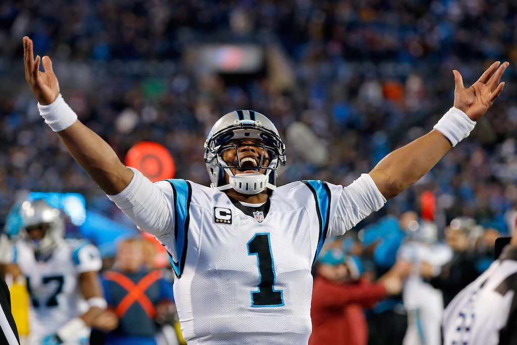 Cam Newton celebrates a touchdown during the NFC Championship Game