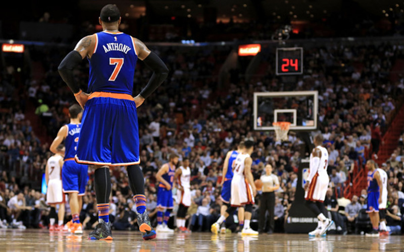 Carmelo Anthony stands on the court between plays.