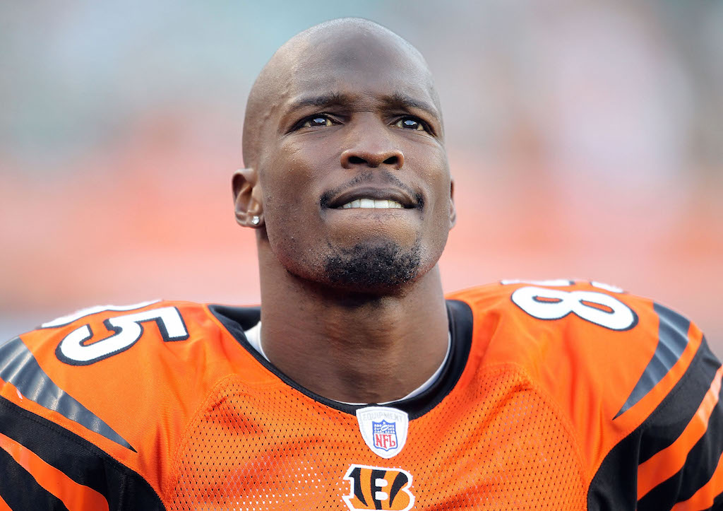 Chad Johnson looks at the scoreboard from the sideline.