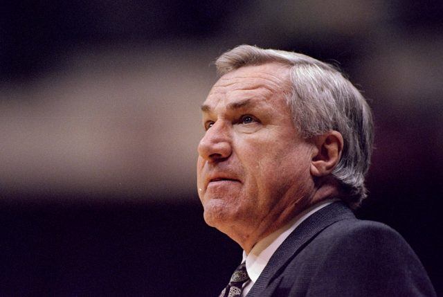 Dean Smith of the North Carolina Tar Heels looks on during a tournament game.