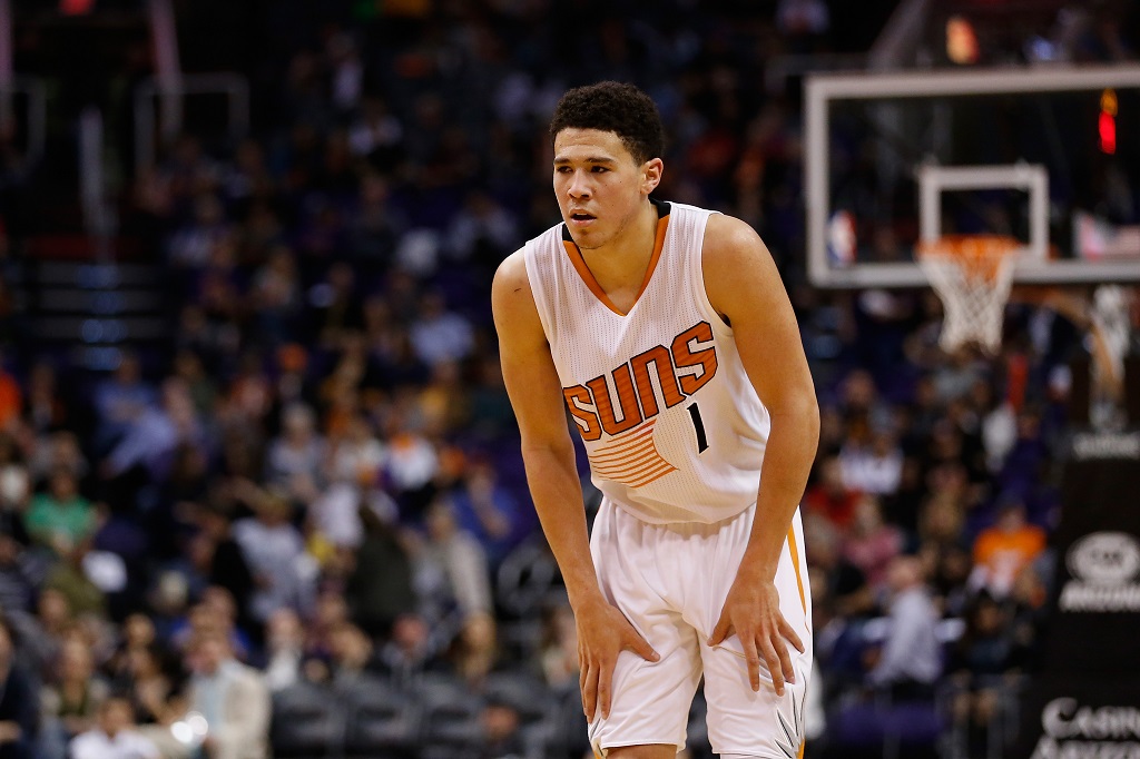 Devin Booker looks on during the second half of the NBA game at Talking Stick Resort Arena on January 19, 2016 in Phoenix, Arizona