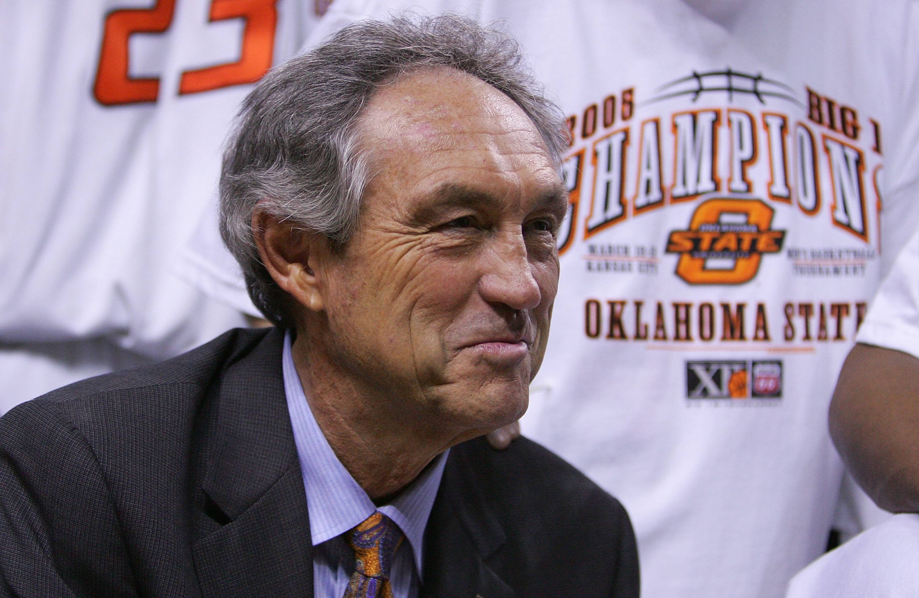 Eddie Sutton smiles after winning a championship.