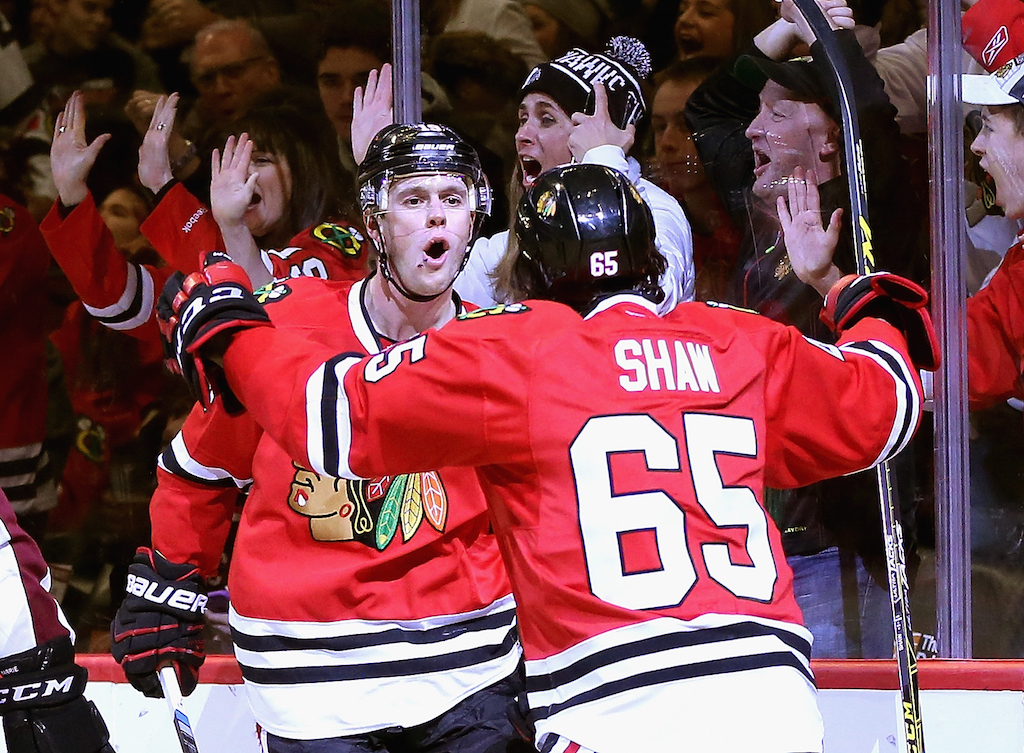 Jonathan Toews #19 of the Chicago Blackhawks celebrates his second period goal with teammate Andrew Shaw #65